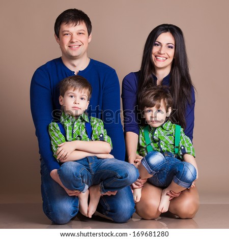 Portrait of happy fun beautiful family with two children