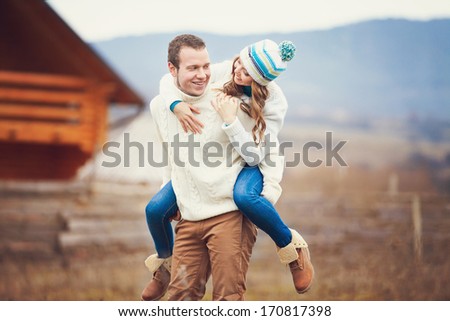 Young couple walking together while enjoying a day in the park