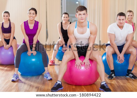 Group of friends working out at the fitness center