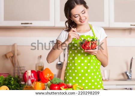 Young Woman Cooking in the kitchen. Healthy Food. Dieting Concept. Healthy Lifestyle. Cooking At Home. Prepare Food