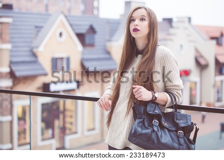 Fashion Young Woman with a leather bag. Fashion photo