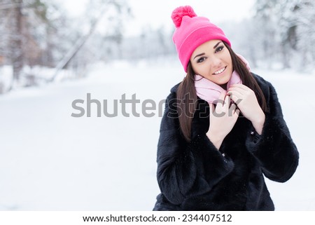 Winter woman in snow outside in nature. Portrait closeup outdoors in snow.