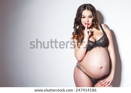 Sexy pregnant woman in lingerie. Stylish and sexy pregnancy.