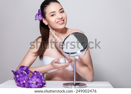 Beauty face skin care woman sitting portrait of beautiful attractive young model