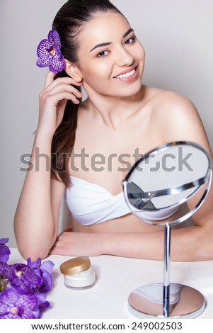 Beauty face skin care woman sitting portrait of beautiful attractive young model