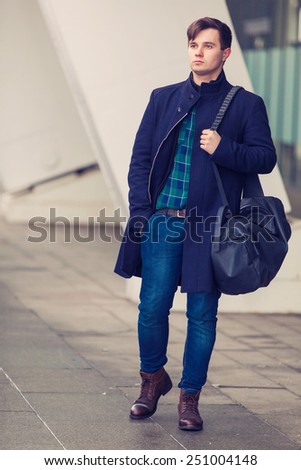 Young urban businessman in street
