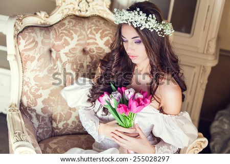 Young beautiful bride with wreath of flowers