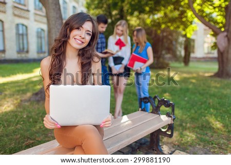 Shot of college students hanging out on campus. Happy classmates