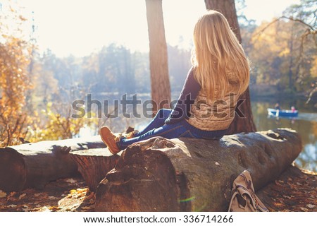 Active healthy woman hiking in beautiful forest. Portrait of an attractive young woman out hiking on an sunny day