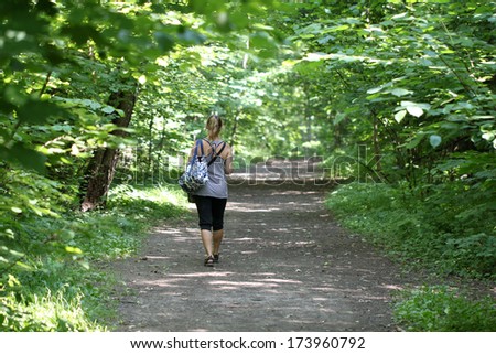Girl walking in the woods