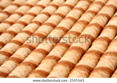 Striped wafer tubules with a chocolate cream, (look similar images in my portfolio)