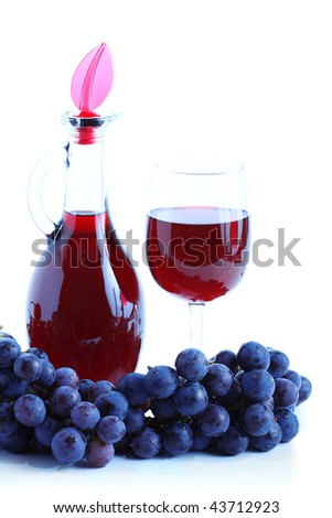 Blue grape cluster and red wine, white background