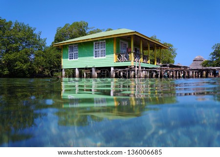 Typical Caribbean stilt house over water of the Caribbean sea, Bocas del Toro archipelago, Panama