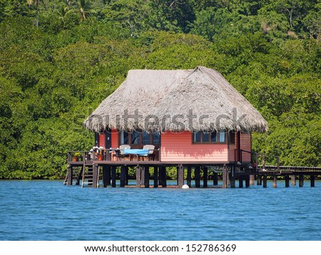 Thatched cabin above the sea on the tropical island of Bastimentos, Caribbean sea, Bocas del Toro, Panama