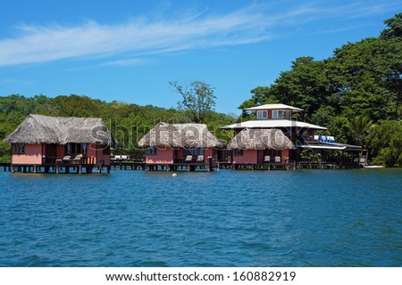 Eco resort with thatched bungalow over water, island of Bastimentos, Caribbean sea, Bocas del Toro, Panama