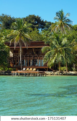 Tropical Seaside House With Coconut Trees And A Dock With Lounger, Caribbean Sea, Panama