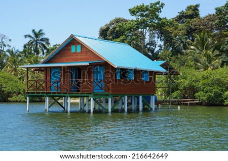 bungalow on stilts over water of the Caribbean sea, Bocas del Toro, Panama