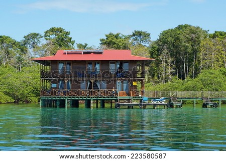 Off grid Caribbean hotel over water with solar panels, Panama, Central America