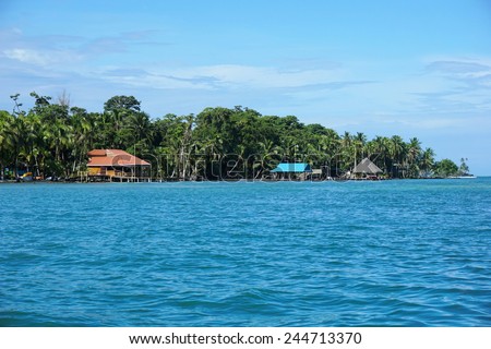 Coast of Carenero island with waterfront restaurant, Caribbean, Bocas del Toro, Panama, central America