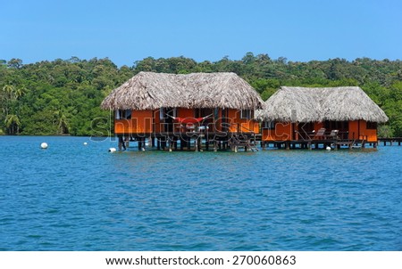 Overwater bungalow with thatched roof, Caribbean sea, Bocas del Toro, Panama