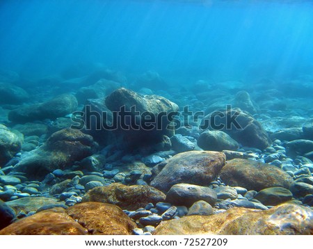 Underwater light on a rocky seafloor in the Mediterranean sea