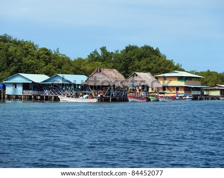 Exotic restaurant over the Caribbean sea with boats and tourists, Cayo coral, Bocas del Toro, Panama
