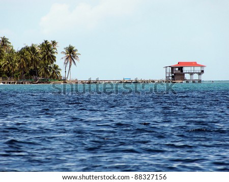 Tropical restaurant on stilts in construction over the Caribbean sea, Carenero island, Bocas del Toro, Panama