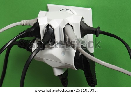Multiple electric plugs in wall outlet