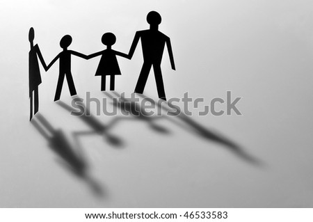 Mother, father and two children with shadows