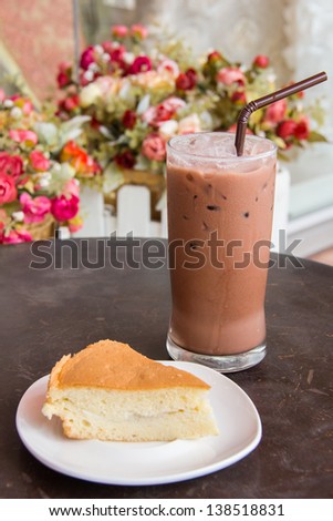 Cocoa ice and cake with flower background