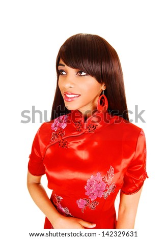 A lovely young black woman in a red Chinese dress standing in a portrait  picture for white background.