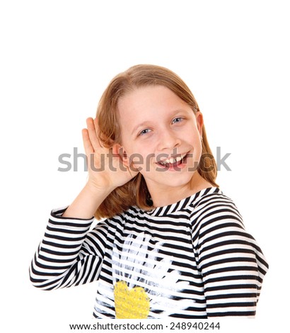 A beautiful young girl standing for white background with her hand on her ear, she can not hear.