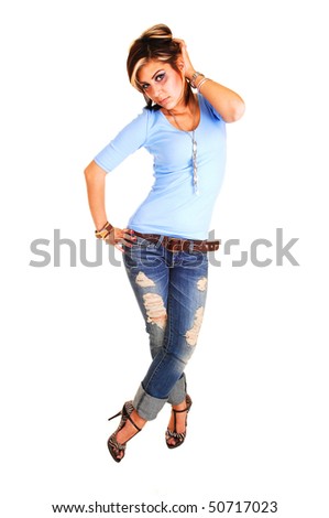 A pretty tall young girl standing with her front to the camera,  in high heels, jeans and blue sweater for white background.