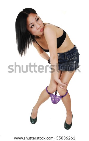 stock photo A young pretty Asian woman with a bra and mini skirt loosing 