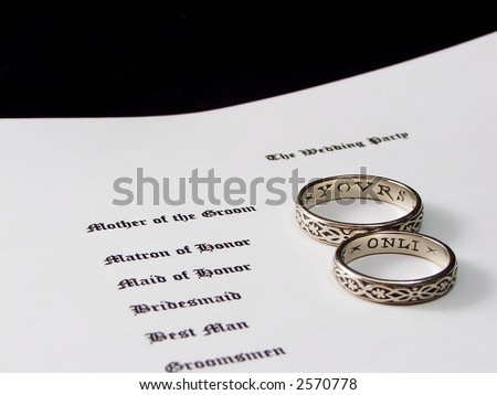 wedding rings on a wedding program