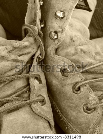 old work boots in sepia