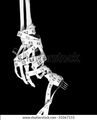 skeletal hand with fork and tape measure, for concept \