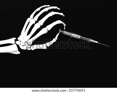 skeleton hand holding a hypodermic needle