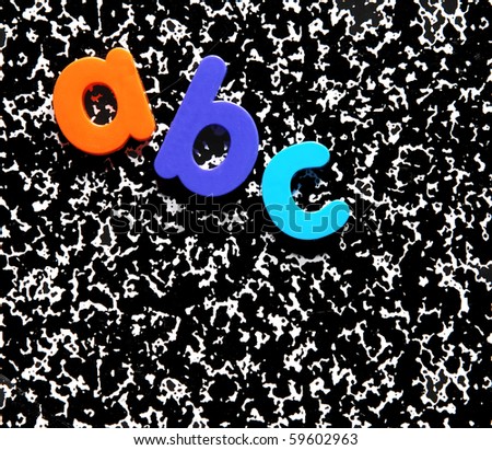 abc on a composition notebook background