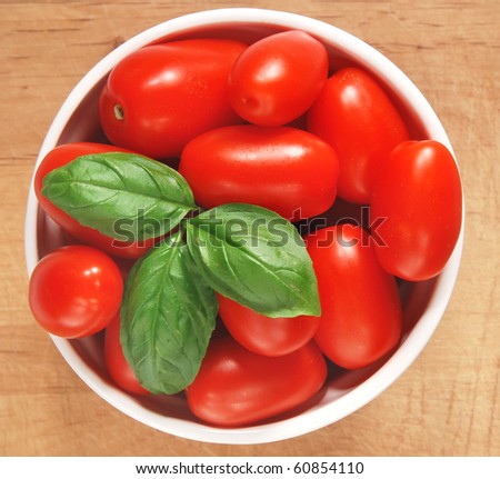 fresh homegrown grape tomatoes with basil