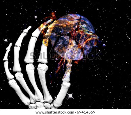 skeletal hand clutching a cracked exploding earth - space source images from NASA/courtesy of NASAimages.org