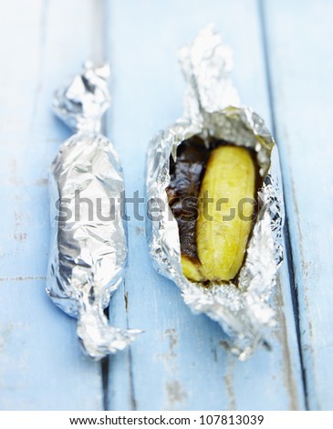 Bananas and chocolate cooked in aluminium foil