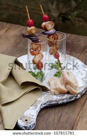 Mixed meat and fish brochettes