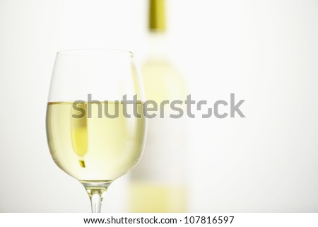 Glass and bottle of white wine