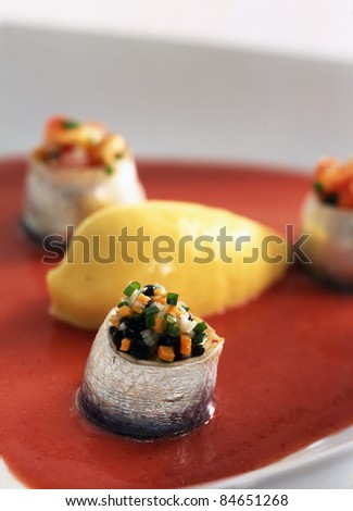 Rolled sardines with strawberry soup and sweetcorn ice cream