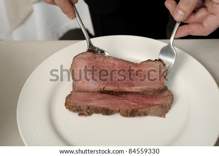 Placing the sliced roast beef in a plate