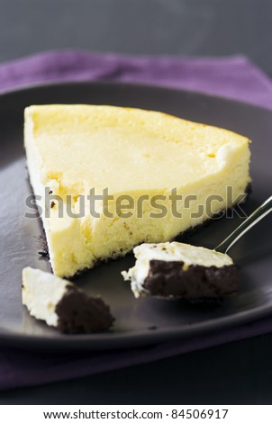 Slice of cheesecake with an Oreo biscuit base