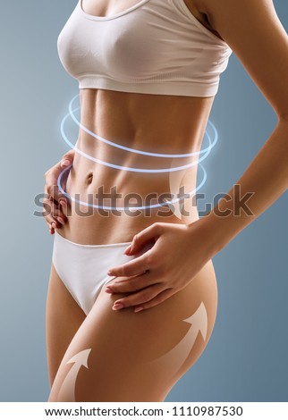 Slim woman body with the arrows shows lifting effect. Over blue background.