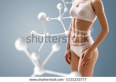 Woman with perfect body near molecule chain. Slimming concept. Improvement of metabolism concept.