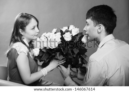 Man gives a bouquet for his girlfriend